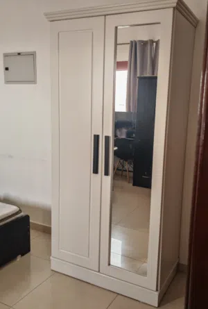 Wardrobe 2 doors with mirror .local made very strong heavy duty like new one month used only