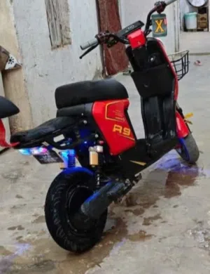 "Electric motorcycle.  "دراجة كهرباية