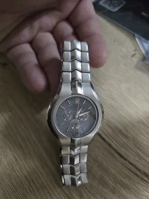 Rolex . Analog Quartz . Silver0