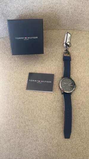 Tommy Hilfiger men's sport watch with 46mm case, navy dial, and blue silicone band.