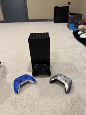 Xbox Series X. With special Xbox bag and three controllers.