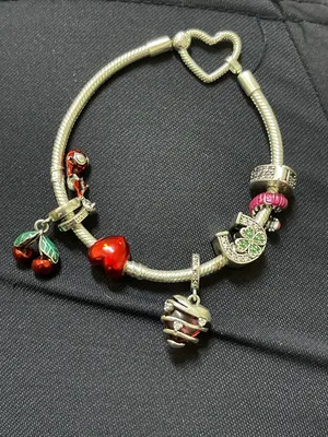 Pandora charm’s bracelet with 7 charms with a really good price and used in excellent condition