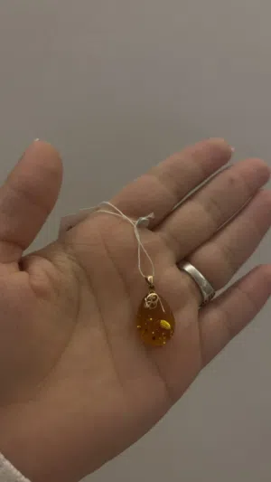 Silver pendant with natural amber