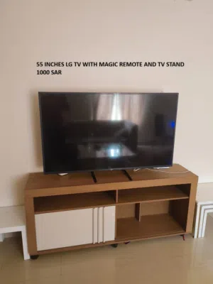 LG 55" 4K Smart TV UHD AI ThinQ with magic remote. (Like new). TV stand is free