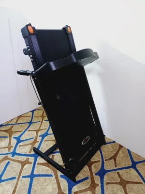 The image shows a black, foldable electric treadmill.   It is designed for home use and can be folde