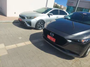 تأجير سيارة مازا 2024 سيدان أوتوماتيك بنزين باللون الأحمر يوميًا