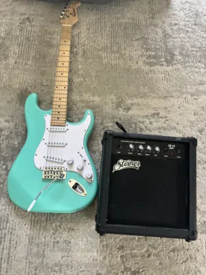 Electric guitar with speaker