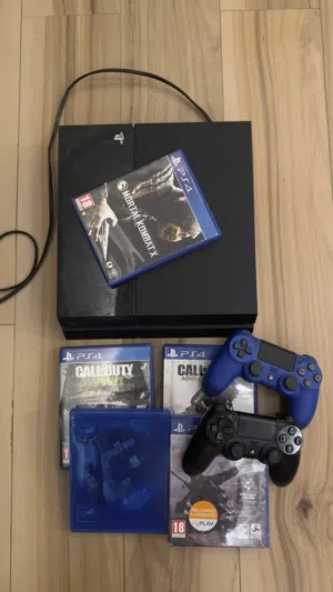 PlayStation 4 with 2 controllers and games