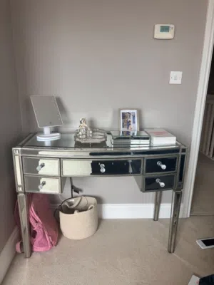 This is a modern silver mirrored dressing table with crystal-style knobs comes with a big mirorr