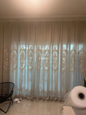 Light ivory embroidered curtain set — full-length, gently used