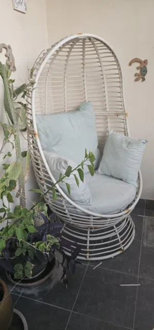 Outdoor chair with cushions. sightly damaged on seat as shown. BD10