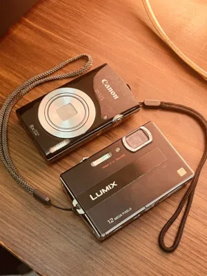 PANASONIC DIGICAM (DMC-FP8) and CANON IXUS 185 -good condition comes with everything