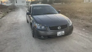 نيسان التما بنزين جير عادي موديل 2006