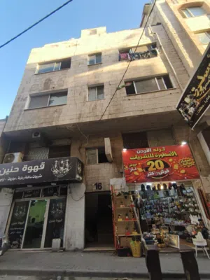 عمارة للبيع جرش - وسط السوق التجاري