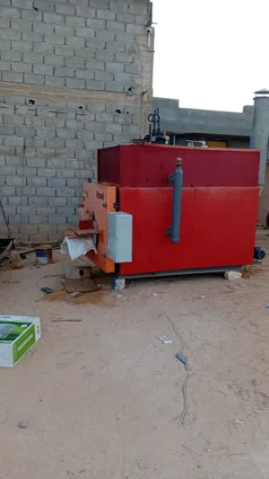 غلاية بخار ومكبس علف ودشاش