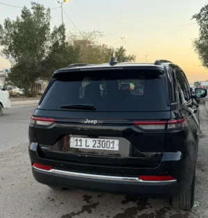 جيب كراند شيروكي لمتيد هايبرد بلك ان 2024 بحالة الوكالة  مكفولة رقم بغداد23001