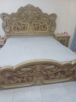 king size bed with dressing table and side tables