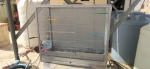 قفص طيور مطير