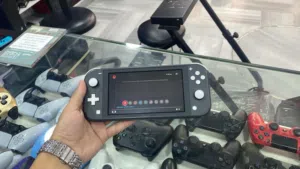 Nitendo switch lite gray with box and the charger نايتيندو سويتش لايت لون سكني مع علبة وشاحن اصلي