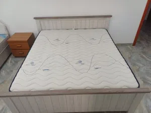 High quality mattress and a simple bed frame.