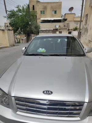 كيا اوبتيما 2006 للبيع او البدل على سيارة هايبرد احدث مع دفع الفرق