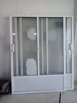 عدة محل رفوف واباب مخازن وأبواب المنيوم