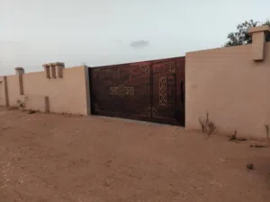 قطعه أرض زراعيه و تمشي سكنيه  مكانها الصطارنه ترهونه