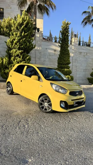 كيا بيكانتو 2015 توماتيك ماتور 1250 لون اصفر شبابي بحالة جيده جدا