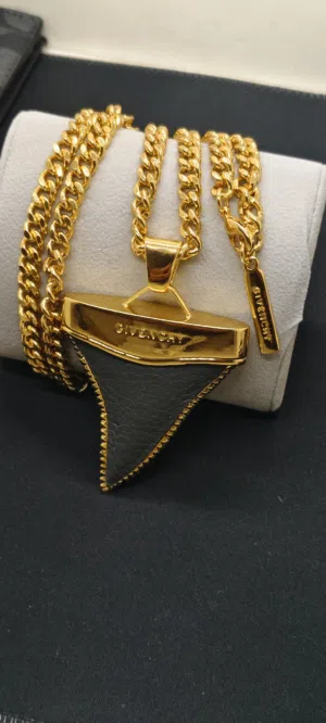 Givenchy Black Leather Shark Tooth Pendant Necklace Givenchy's Shark Tooth necklace is the perfect a
