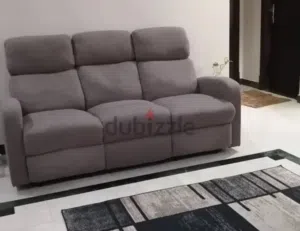 Brown color three seater sofa with two Recliner Location : Ghoubra
