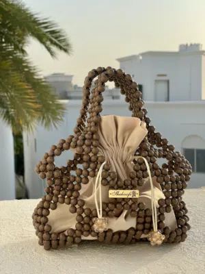 حقيبة خرز يدوية أنيقة كريمي وبني