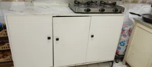 Sanford stove 3 burner for sale immediately with kitchen storage cabinet
