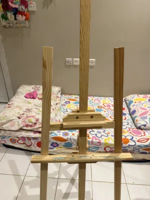 Painting easel with mostly new paint and new brushes