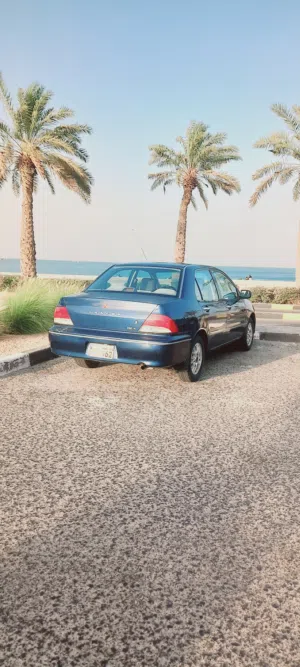 لانسر 2003 شرط الفحص صبغ الوكاله بالكامل مكيف ثلج  حاله نادره  اليبانى الاصلى