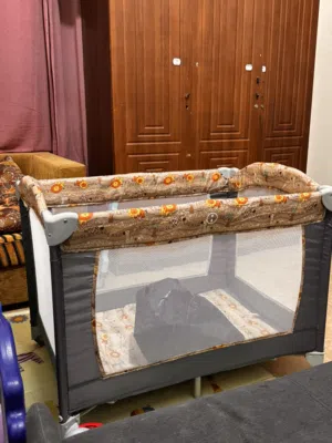 Portable and foldable baby playpen/ travel cot with diaper changing table