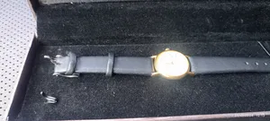 ساعة ملكية ذهبية وهدية