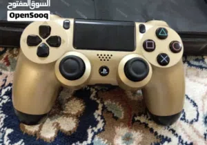 جير PS4 ذهبي أصلي + شريطين من أقوى الألعاب (بحالة ممتازة)