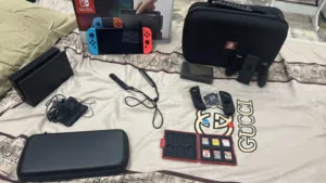 nintedo switch مستعملXAJ1,  HAC-001(اول اصدارات) patched،كلشي من العلبة وملحقات والعاب،شوف الوصف