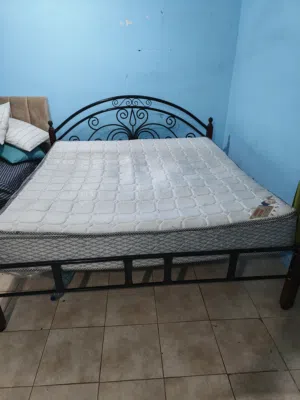 Steel cot with mattress