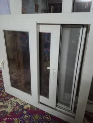 2 شباك و بلكونه للبيع بحاله جيده جدا زجاج عاكس الضوء عازل للحرارة والصوت من اجود انواع ال PVC