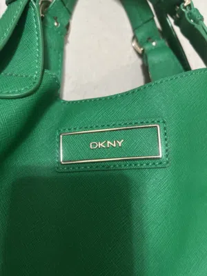 Almost new DKNY middle size handbag, elegant green color