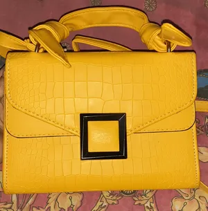 Yellow leather bag with brown linen interior