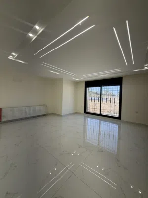 شقة طابقية طابق اول بأجمل مناطق البنيات / طريق المطار