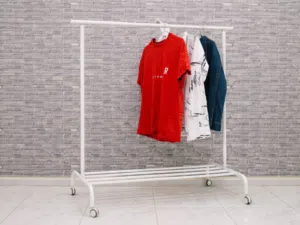 White IKEA RIGGA Adjustable Clothes Rack with WheelsAbu shagara