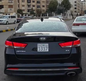 كيا اوبتما 2018/ 2000cc/ 4 سلندر وارد امريكا شرط الفحص غير مكينه شاص صبغ الوكاله  مغير لوح من لوح رف