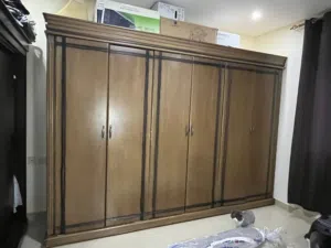 Large wooden wardrobe and carpets