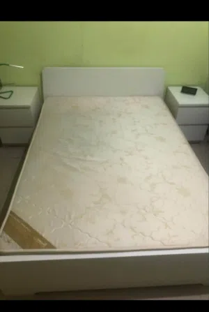 Bed with medical mattress and 2 night stands