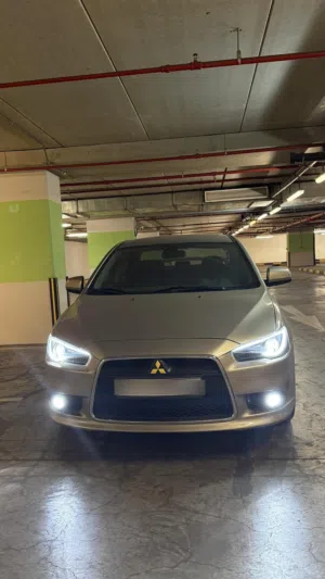 متسوبيشي لانسر GT 2009 لون ذهبي /يابانيه 100٪. (made in japan)