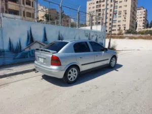 سيارة أويل استرا سلفر موديل 2003 مدهونة ومرتبة