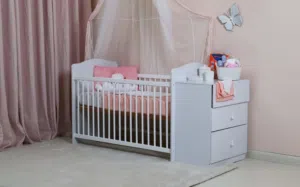 White convertible baby crib with mattress and attached changing dresser - Excellent condition